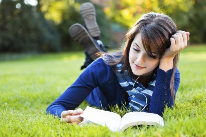 Hot-girl-reading-book-in-garden